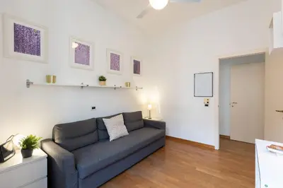 a living room with a couch in a room at SAINT PETER HOME by Rental in Rome in Rome
