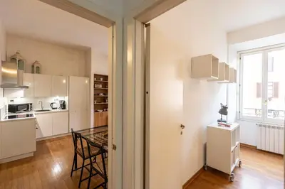 a kitchen and dining room with a table in a room at SAINT PETER HOME by Rental in Rome in Rome