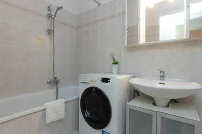 a bathroom with a washing machine and a sink at SAINT PETER HOME by Rental in Rome in Rome
