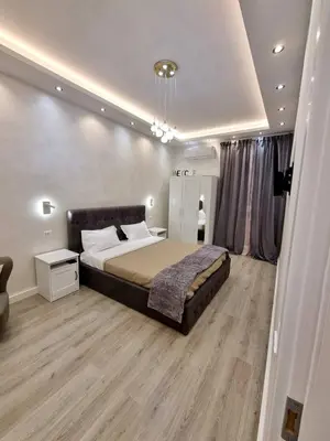 a bedroom with a large bed in a room at Apartment near the Colosseum, with metro line A a 2 minutes walk away in Rome