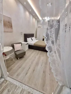 a room with a bed and a couch and a chair at Apartment near the Colosseum, with metro line A a 2 minutes walk away in Rome