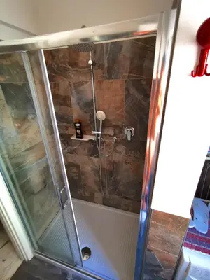 a bathroom with a shower and a toilet at Rouge Studio - 10 min from Vatican in Rome