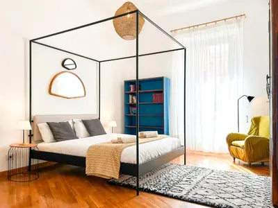 a bedroom with a canopy bed in a room at Testaccio B45 Guesthouse in Rome