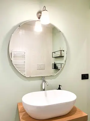 a bathroom with a white sink and a mirror at Testaccio B45 Guesthouse in Rome