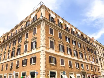 a large brick building with windows on top of it at Testaccio B45 Guesthouse in Rome