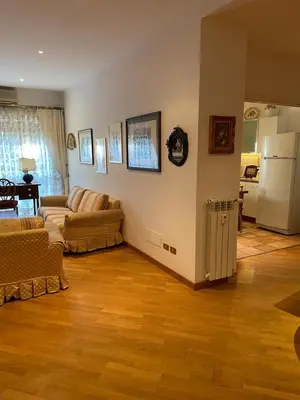a living room with a couch and a refrigerator at Vicario138 in Rome
