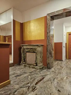 a living room with a fireplace in a building at The Cicer One in Rome