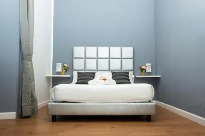 a bedroom with a bed with a stuffed animal on it at The Cicer One in Rome