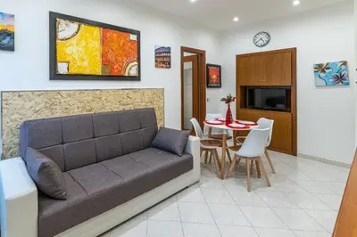 a living room with a couch and a table at Pigneto Vannini Roma in Rome