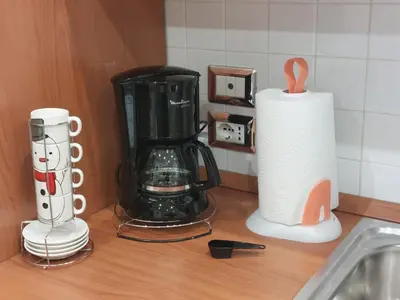 a kitchen counter with a blender and a roll of paper towels at Pigneto Vannini Roma in Rome