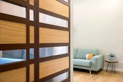 a sliding door leading into a living room with a chair at LALY LOVE in Rome