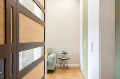 a door leading to a living room with a couch at LALY LOVE in Rome