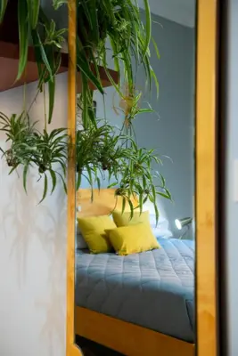 a bedroom with a bed with plants on it at Myway RDR Apartment in Rome