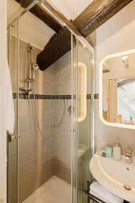 a bathroom with a shower and a sink at La mansarda del Papa - ZENO 05 in Rome