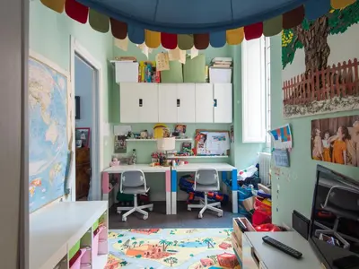 a classroom with a desk and two chairs in a room at Apartment San Salvatore by Interhome in Rome