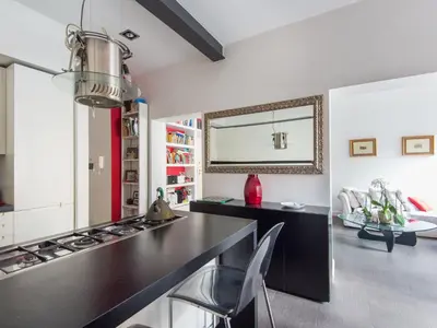 a kitchen with a black counter and a stove at Apartment San Salvatore by Interhome in Rome