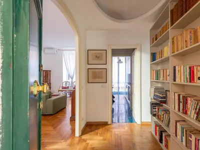 an archway in a living room with books at Apartment Virgilio by Interhome in Rome
