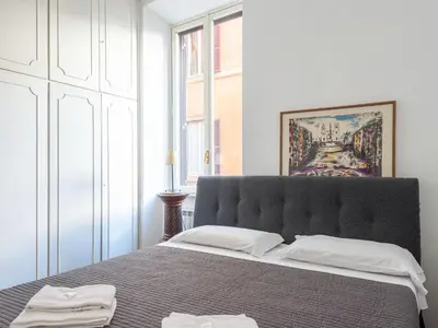 a bedroom with a large bed with two white pillows at Apartment Virgilio by Interhome in Rome