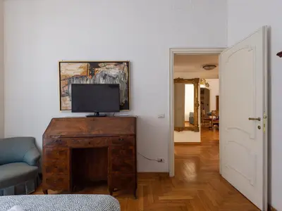 a living room with a tv on top of a fireplace at Apartment Virgilio by Interhome in Rome