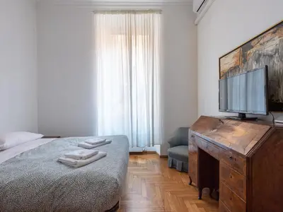 a bedroom with a bed and a flat screen tv at Apartment Virgilio by Interhome in Rome