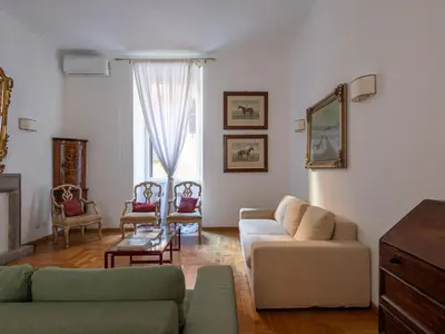 a living room with a couch and a table at Apartment Virgilio by Interhome in Rome