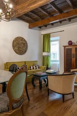 a living room with a couch and a table at Residenza Clodio Spanish Steps in Rome