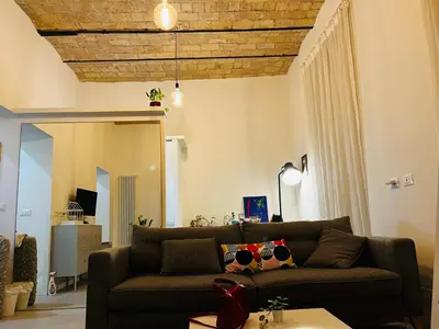 a living room with a couch and a table at Sweet Life House Rome Cavour in Rome