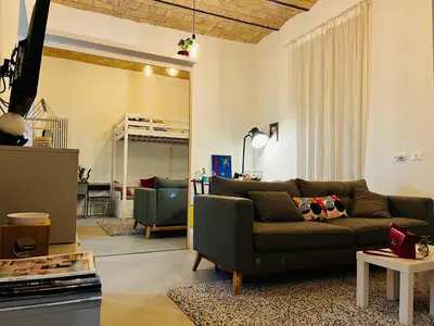 a living room with a couch and a table at Sweet Life House Rome Cavour in Rome
