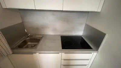 a small kitchen with a sink and a stove at GreenSpace Romantic Studio - Piazza del Popolo in Rome