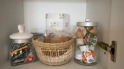 a refrigerator with a basket of food and a mixer at GreenSpace Romantic Studio - Piazza del Popolo in Rome