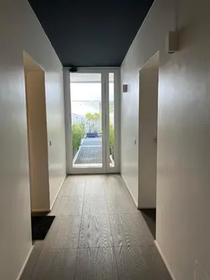 an empty hallway with an open door to a patio at GreenSpace Romantic Studio - Piazza del Popolo in Rome
