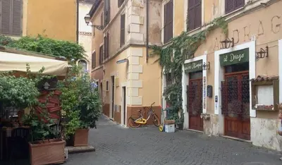 an alley with a bike parked next to a building at Casina Tiberina Suite in Rome