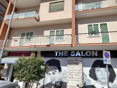 a building with a mural on the side of it at Astmigo in Rome