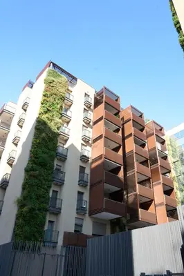 an apartment building with a vertical garden on it at Trastevere Boutique with Gym and Steam Shower in Rome