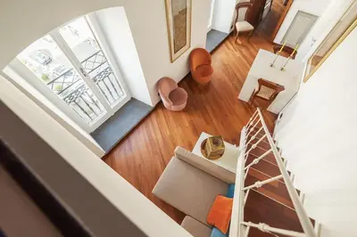 an overhead view of a living room with a staircase at HospitalityRome Piazza di Spagna View in Rome