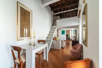 a living room with a white table and chairs at HospitalityRome Piazza di Spagna View in Rome