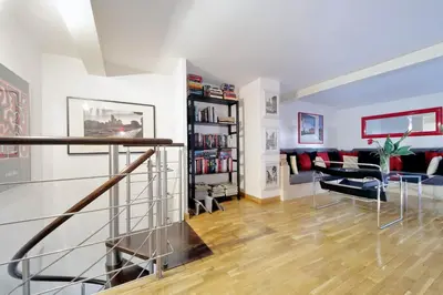 a living room with a staircase and a couch at Design accommodation in Rome