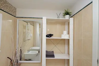 a bathroom with a toilet and a sink at Design accommodation in Rome