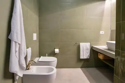 a bathroom with a toilet and a sink at RELAIS DEI GOTI in Rome