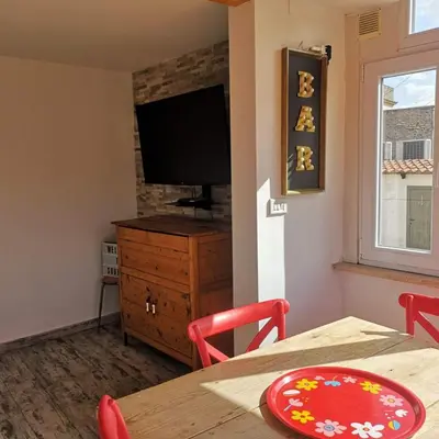 a dining room with a table and a television at Soulmate Rooftop Apartment in Rome