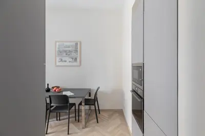 a dining room with a table and chairs at iFlat Vatican Elegant Apartment in Rome
