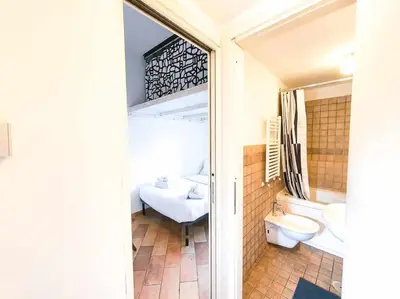 a bathroom with a sink and a toilet and a tub at Cozy Apartment in Pigneto up to 4 in Rome
