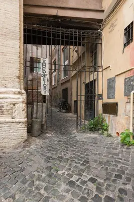an entrance to a building with a gate at Campo de' Fiori appartamento via di Grotta Pinta in Rome
