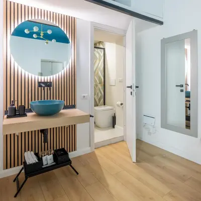 a bathroom with a sink and a mirror at LABICANA Apt - Colosseum in Rome