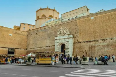 a group of people walking in front of a building at Magikrooms Muse in Rome