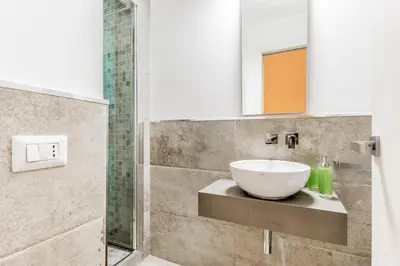 a bathroom with a bowl sink on a counter at TH Trastevere Luxury-S.Cosimato 2bd-2bt in Rome