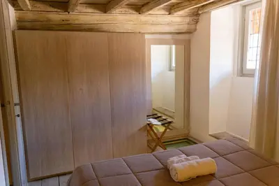 a bedroom with a bed and a wooden ceiling at Ottavia al Foro - Luxury Property in Rome