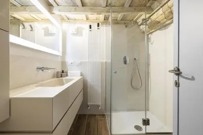 a bathroom with a sink and a shower at Ottavia al Foro - Luxury Property in Rome