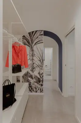 a room with a hallway with a black bag on a shelf at Navona Harmony Apartments in Rome
