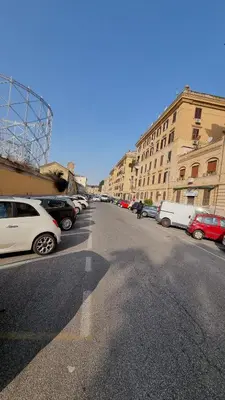 a street with cars parked in a parking lot at Gazometro Rome Holiday House - Rome Vacation M&D in Rome